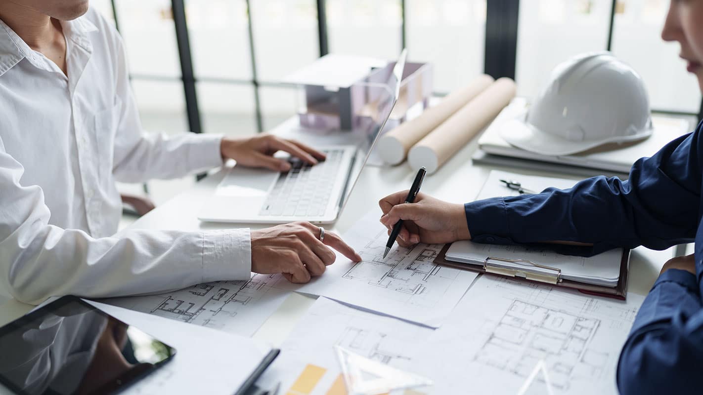 Architecture drawing on architectural project business architecture building construction Colleagues designer Planning Design on blueprint and compasses